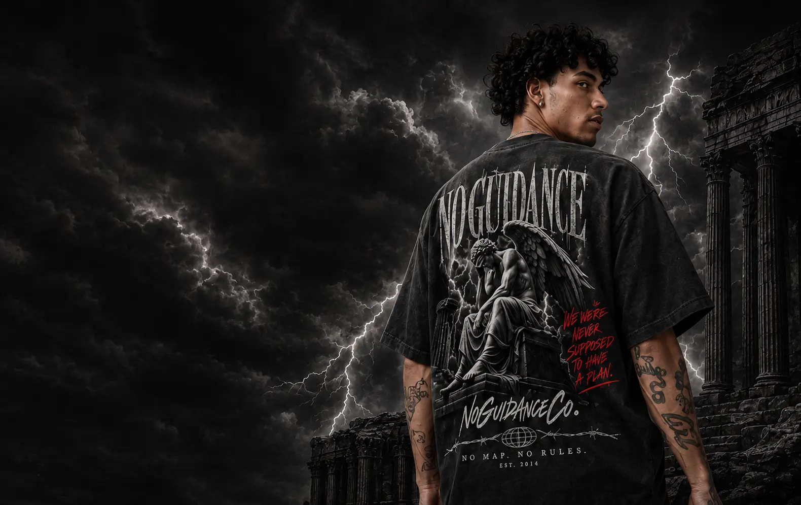 No Guidance campaign: model wearing a graphic tee among stone columns