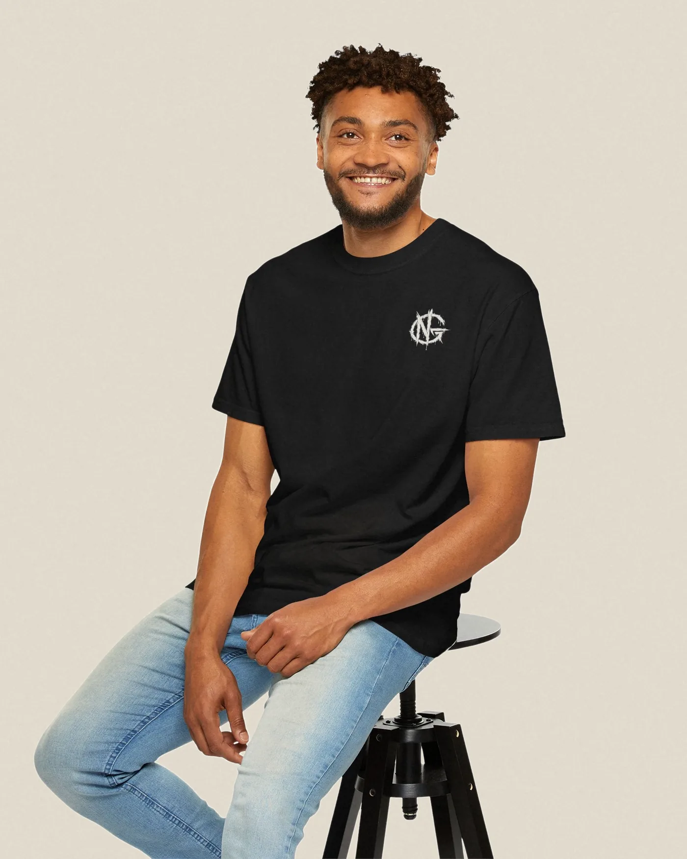 No Guidance No Plan tee in black worn with the NG chest mark visible