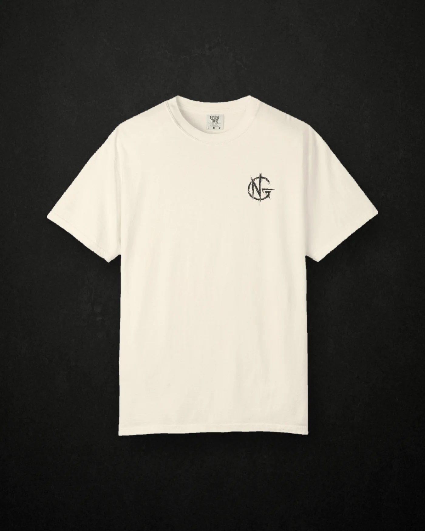 No Guidance Trust None tee in ivory, front, with the circular NG chest mark